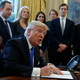 President Donald Trump signs the executive order for the Keystone XL Pipeline. Photo: AP